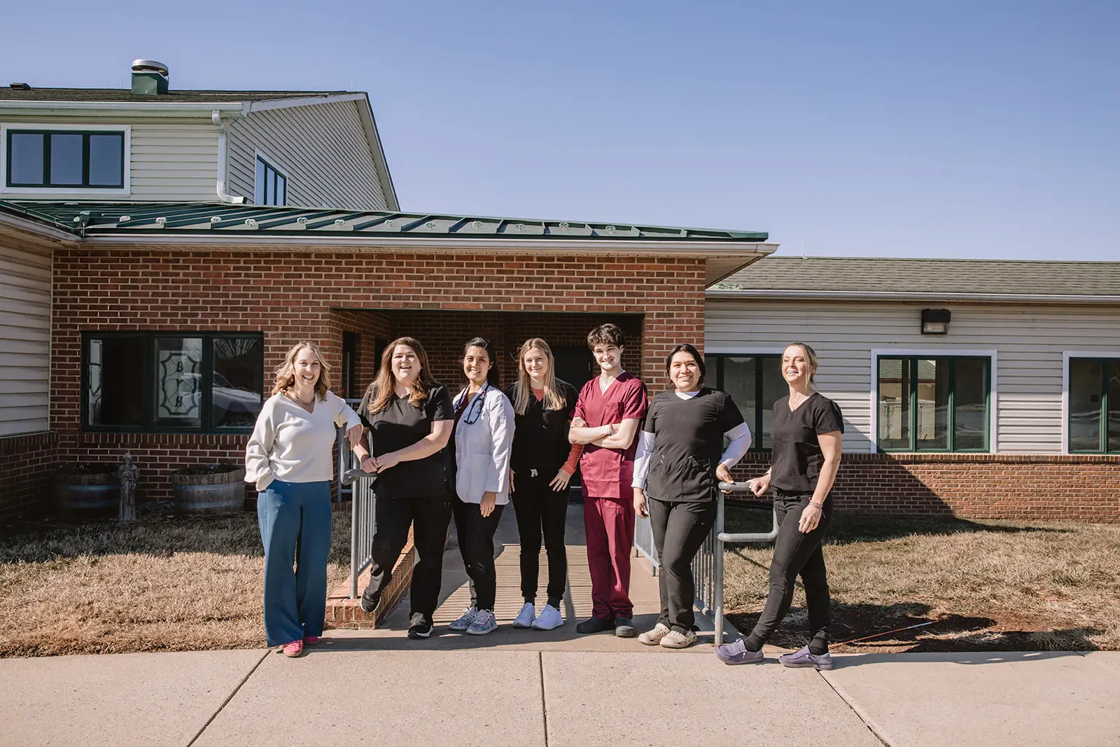 Buckeystown Veterinary Hospital staff pose for a group photo outside the practice in Buckeystown, MD.